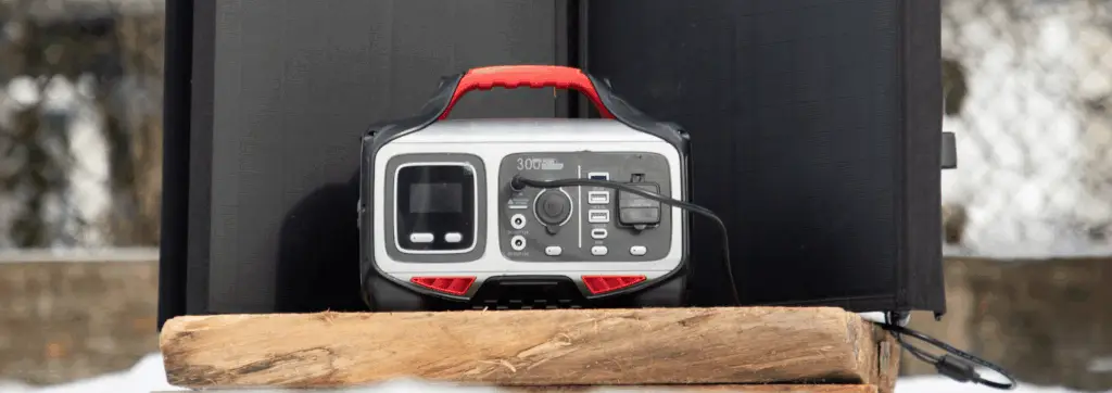 Portable solar generator setup with foldable solar panels charging outdoors.