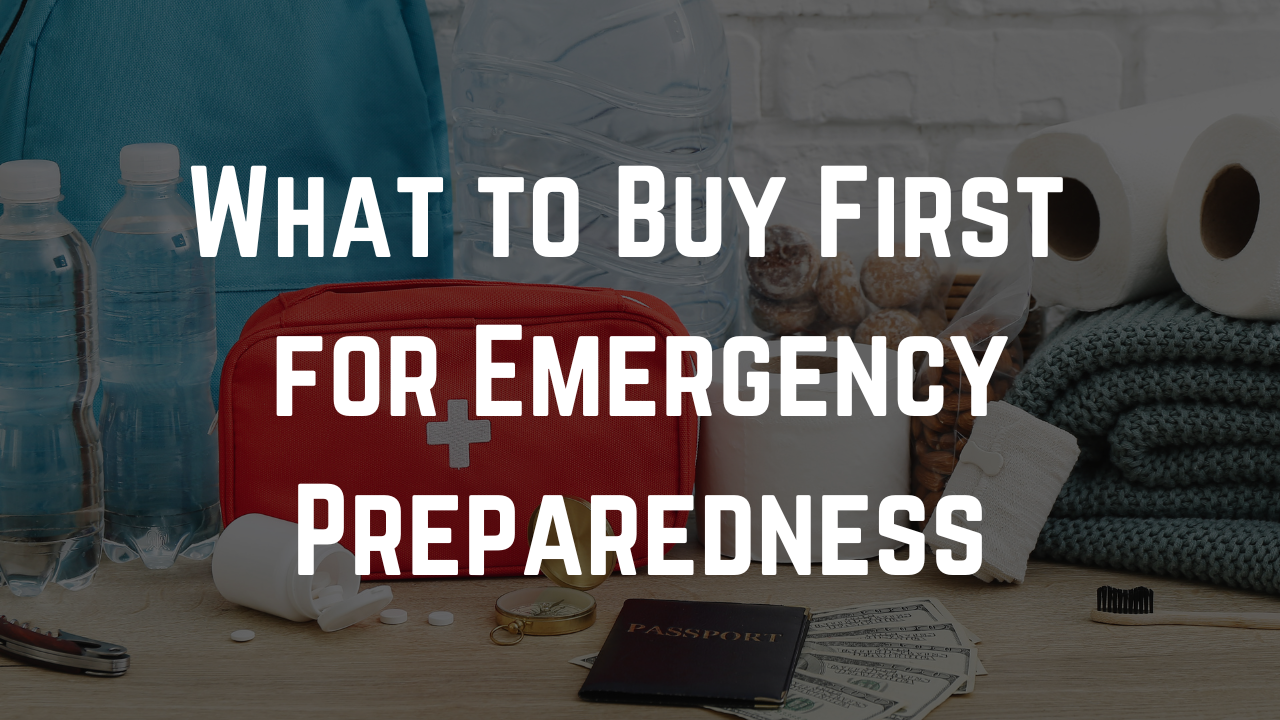 Emergency preparedness supplies on a table, including water bottles, a first aid kit, paper towels, medicine, cash, and a passport, with overlaid text reading “What to Buy First for Emergency Preparedness.”